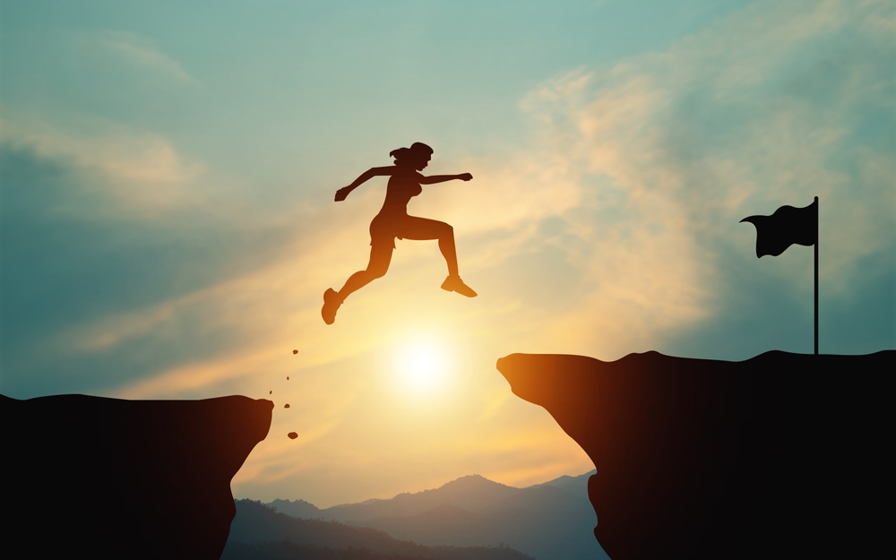 timelyinspiration.com/ Effort,And,Commitment,To,Success.,Silhouette,Of,A,Woman,Jumping