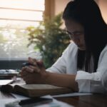 Businesswoman,Praying,With,Eyes,Closed.,Businesswoman,With,Her,Hands,Folded