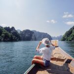 A,Woman,Enjoys,A,Serene,Boat,Ride,On,A,Picturesque