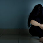 Sad,Woman,Hug,Her,Knee,And,Cry,Sitting,Alone,In