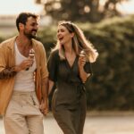 Romantic,Walk.,Smiling,Partners,Sharing,Laughter,And,Sweet,Treats,In