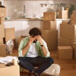 Learning to Breathe Again in the Middle of Emotional Chaos A,Person,Sits,On,The,Floor,Among,Unpacked,Boxes,,Displaying