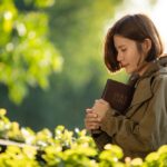 Young,Woman,Praying,To,God,With,The,Bible,,Christianity,,Concept