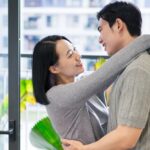 A,Young,Couple,Shares,A,Warm,Moment,In,Their,Bright