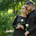 Sad,Couple,With,White,Rose,Flowers,Mourning,Outdoors,,Space,For